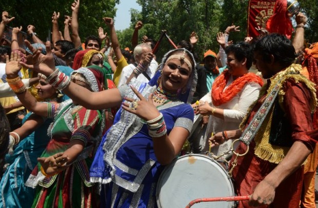 Supporters celebrate the election victory of Narendra Modi's Hindu nationalist Bharatiya Janata Party in on May 16, 2014 (AFP PHOTO/RAVEENDRAN) Supporters celebrate the election victory of Narendra Modi's Hindu nationalist Bharatiya Janata Party on May 16, 2014 (AFP PHOTO/RAVEENDRAN)