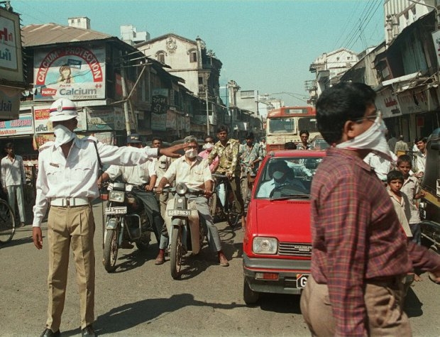 A policeman directs traffic during an outbreak of pneumonic plague in the west Indian city of Surat, on September 30, 1994 A policeman directs traffic during an outbreak of pneumonic plague in the west Indian city of Surat, on September 30, 1994