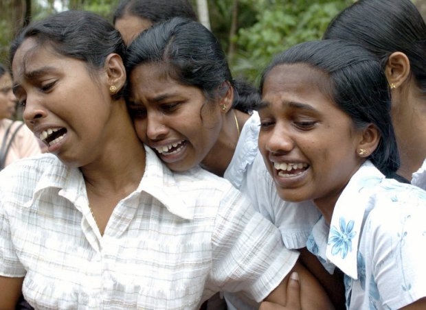 Sri Lankan girls mourn their parents killed in the Indian Ocean tsunami. December 28, 2004 Sri Lankan girls mourn their parents killed in the Indian Ocean tsunami. December 28, 2004