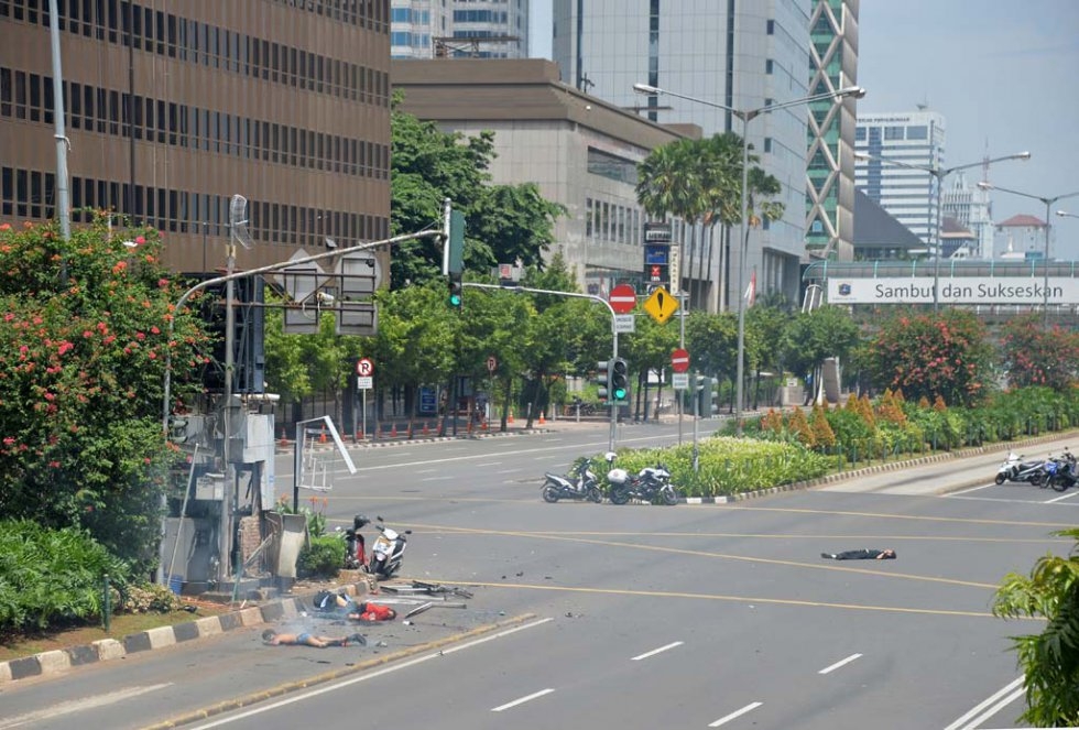 Bodies lie in the street following the blasts. Bodies lie in the street following the blasts.
