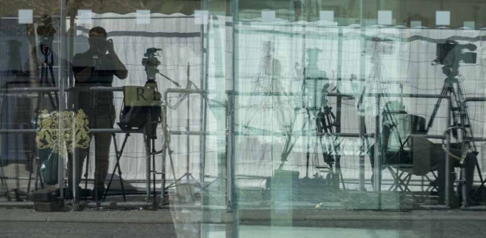 Cameras and tripods reflect in a glass entrance of the Palais Coburg Hotel, where the Iran nuclear talks meetings are held, in Vienna on July 3, 2015 Cameras and tripods reflect in a glass entrance of the Palais Coburg Hotel, where the Iran nuclear talks meetings are held, in Vienna on July 3, 2015