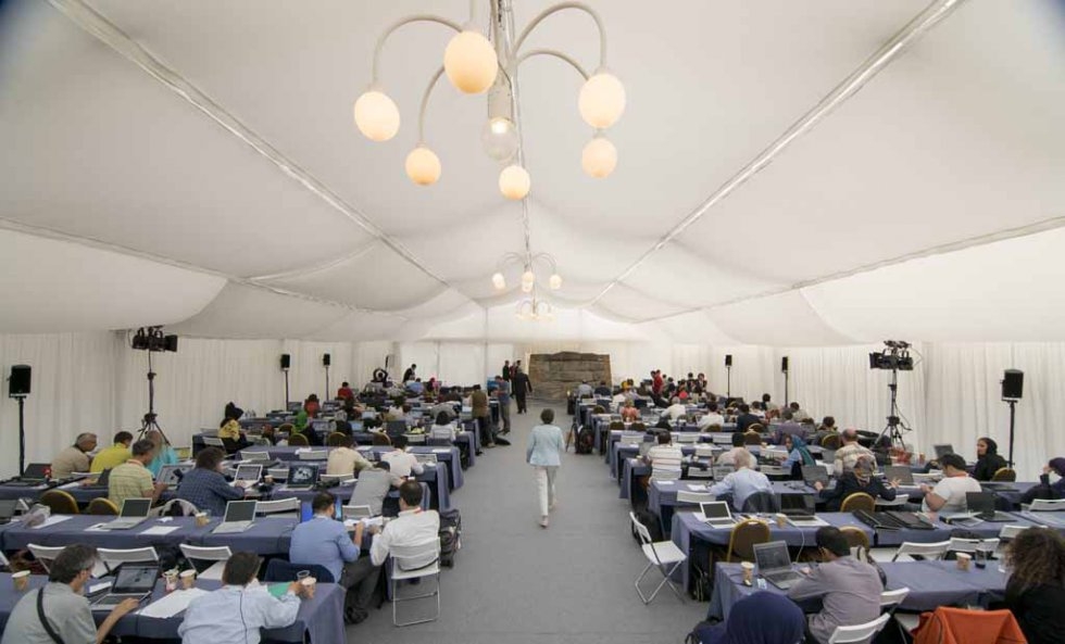 Journalists work and rest in a tent outside the Palais Coburg Hotel in Vienna on July 9, 2015 Journalists work and rest in a tent outside the Palais Coburg Hotel in Vienna on July 9, 2015