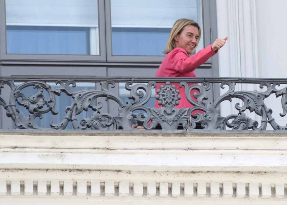 EU top diplomat Federica Mogherini gestures from the balcony of the Palais Coburg Hotel during the Iran nuclear talks in Vienna on July 13, 2015 EU top diplomat Federica Mogherini gestures from the balcony of the Palais Coburg Hotel during the Iran nuclear talks in Vienna on July 13, 2015