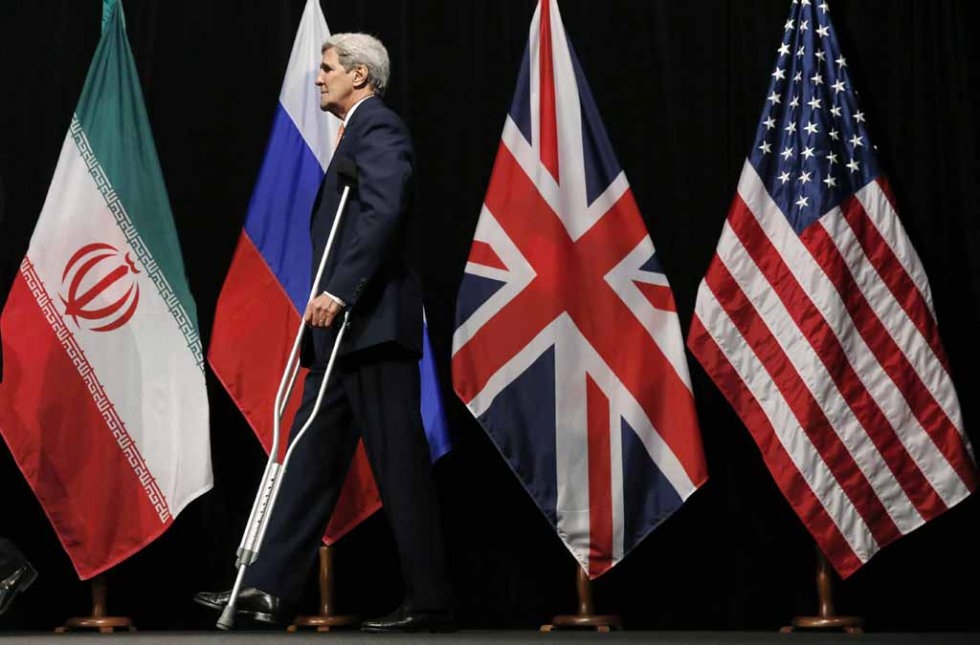 US Secretary of State John Kerry leaves the stage after posing for a picture with foreign ministers and representatives from China, Iran, Britain, Germany, France, and the EU in Vienna, Austria July 14, 2015 US Secretary of State John Kerry leaves the stage after posing for a picture with foreign ministers and representatives from China, Iran, Britain, Germany, France, and the EU in Vienna, Austria July 14, 2015