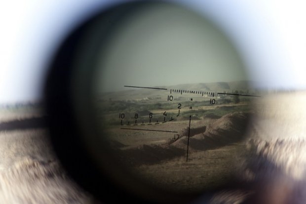 The frontline seen through a telescopic rifle belonging to a Kurdish Peshmerga sniper in the Gwer district, northern Iraq, on September 15, 2014 The frontline seen through a telescopic rifle belonging to a Kurdish Peshmerga sniper in the Gwer district, northern Iraq, on September 15, 2014