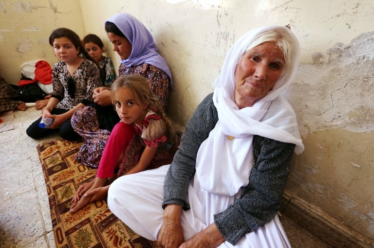 A family of Yazidi Iraqi refugees, in the Kurdish city of Dohuk on August 5, 2014 A family of Yazidi Iraqi refugees, in the Kurdish city of Dohuk on August 5, 2014