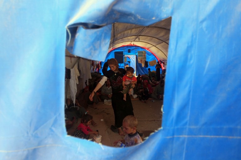 Yazidi Iraqi refugees at the Bajid Kandala camp in Kurdistan's western Dohuk province, on August 13, 2014 Yazidi Iraqi refugees at the Bajid Kandala camp in Kurdistan's western Dohuk province, on August 13, 2014