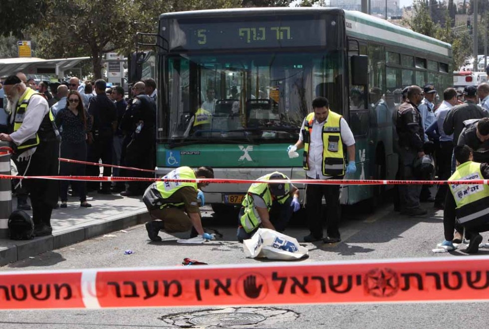 Israeli volunteers clean up blood stains after a Palestinian man stabbed a Jewish man in Jerusalem in October. Israeli volunteers clean up blood stains after a Palestinian man stabbed a Jewish man in Jerusalem in October.