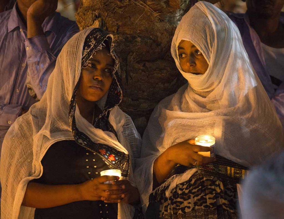 Members of the Eritrean community in Israel attend a memorial for an Eritrean asylum seeker who died of injuries after being shot by a guard and beaten by a mob after being mistaken for an attacker. Members of the Eritrean community in Israel attend a memorial for an Eritrean asylum seeker who died of injuries after being shot by a guard and beaten by a mob after being mistaken for an attacker.