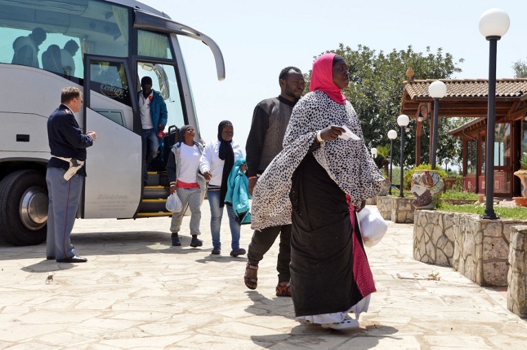"Migrants arrive at the Palazzolo Acreide immigration center on April 17, 2015 "Migrants arrive at the Palazzolo Acreide immigration center on April 17, 2015