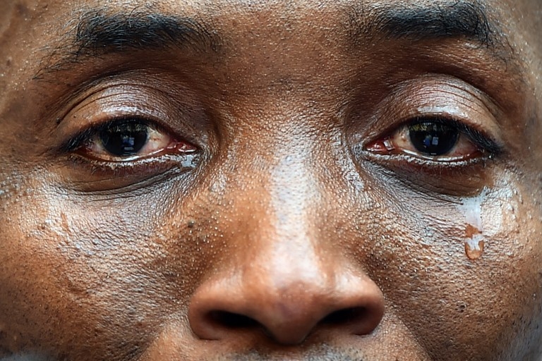 The spokesman for a migrant association cries during a demonstration of asylum seekers before the parliament in Rome, on April 23, 2015 The spokesman for a migrant association cries during a demonstration of asylum seekers before the parliament in Rome, on April 23, 2015