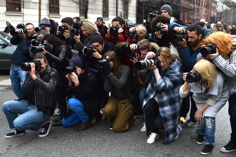People take pictures in the street at Milan Fashion Week on February 27, 2015 People take pictures in the street at Milan Fashion Week on February 27, 2015