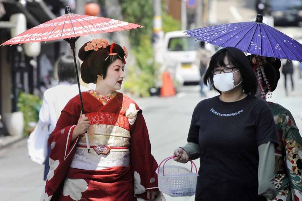 A geisha walks in Kyoto in March, 2009. A geisha walks in Kyoto in March, 2009.