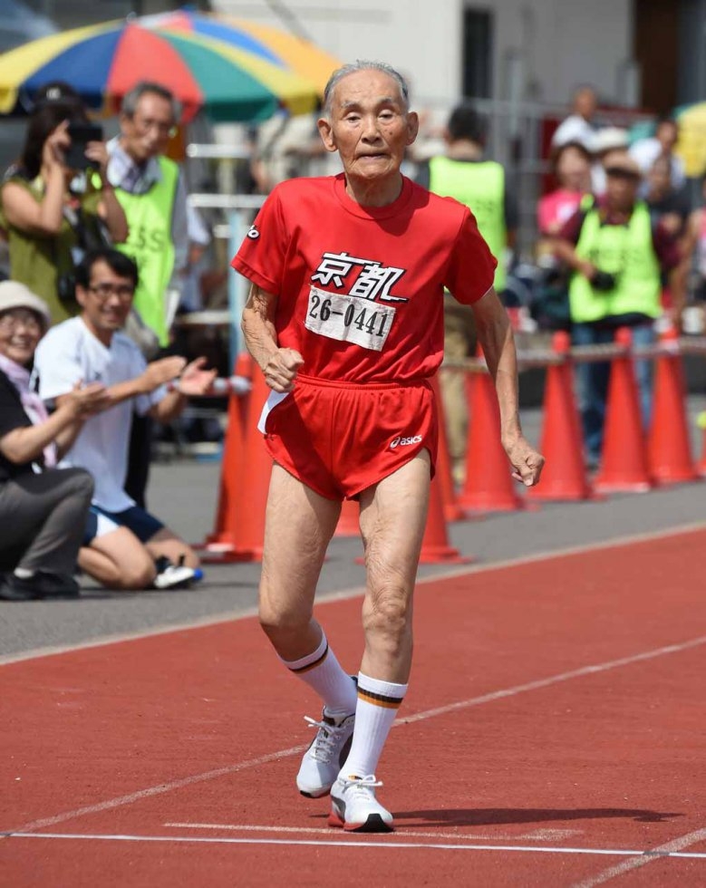 Hidekichi Miyazaki crosses the finish line on his record-setting 100-metre race. Hidekichi Miyazaki crosses the finish line on his record-setting 100-metre race.