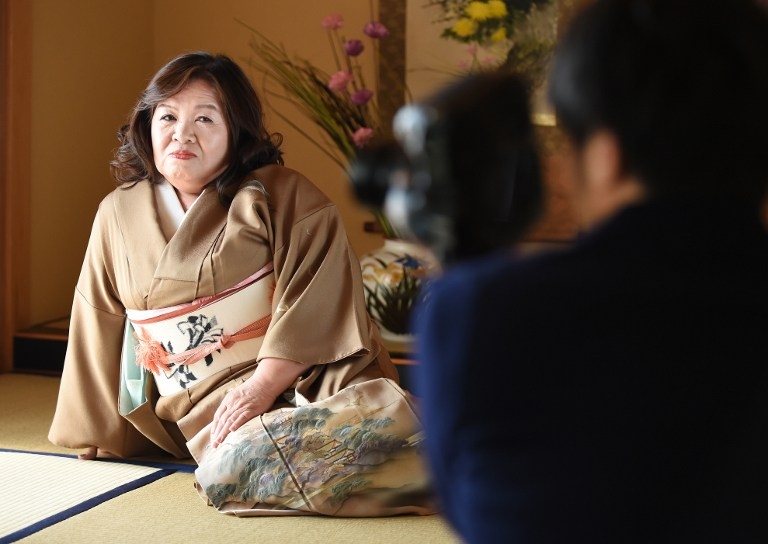 Yasue Tomita, 61, poses on a tatami floor as she makes her debut as a porn actress at a studio in Tsurugashima, Saitama prefecture, on March 17, 2015 Yasue Tomita, 61, poses on a tatami floor as she makes her debut as a porn actress at a studio in Tsurugashima, Saitama prefecture, on March 17, 2015