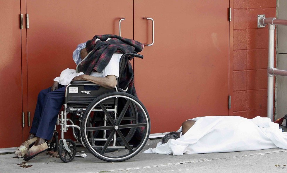 The bodies of two hurricane victims remain at a door of the New Orleans Superdome on September 2, 2005 The bodies of two hurricane victims remain at a door of the New Orleans Superdome on September 2, 2005