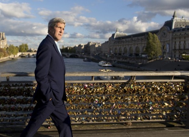 Kerry walks across the Seine in Paris on October 13, 2014 Kerry walks across the Seine in Paris on October 13, 2014