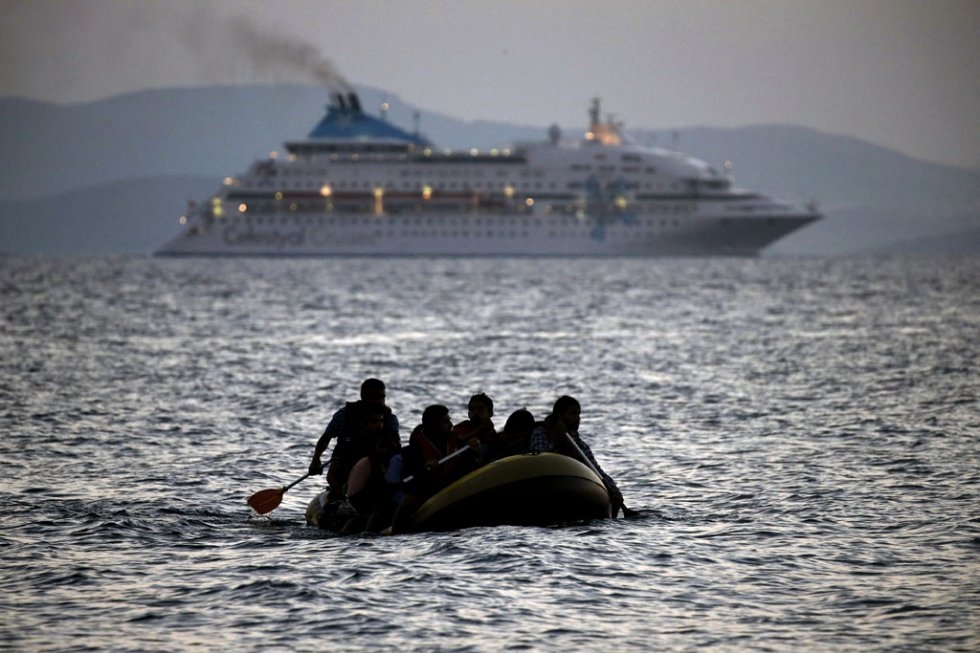 Migrants arrive on the shore of Kos on August 19, 2015 Migrants arrive on the shore of Kos on August 19, 2015