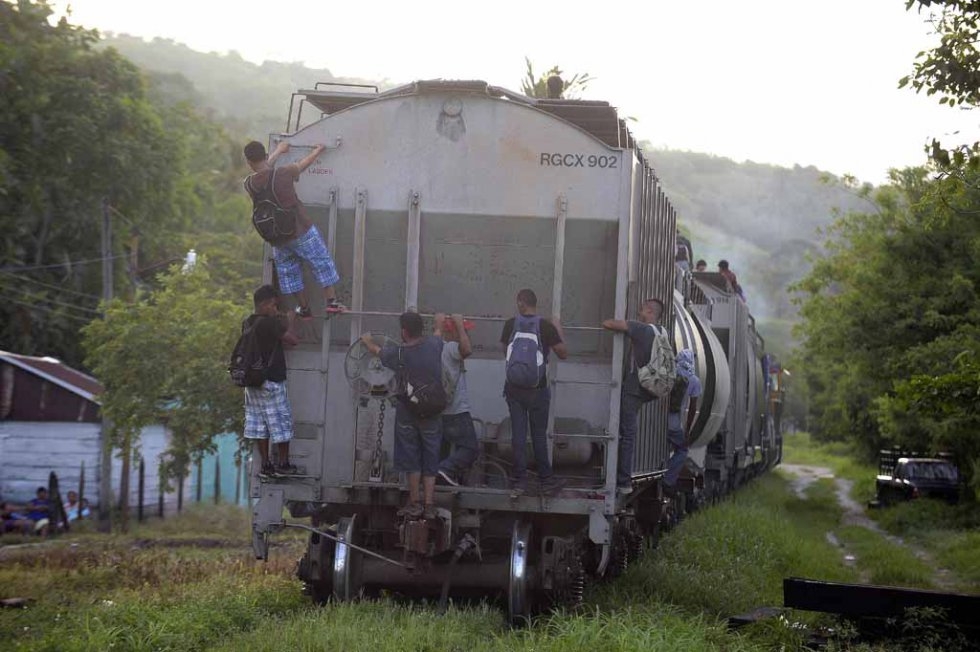 Migrants board a train in Palenque, Chiapas State, Mexico, on June 19, 2015 Migrants board a train in Palenque, Chiapas State, Mexico, on June 19, 2015