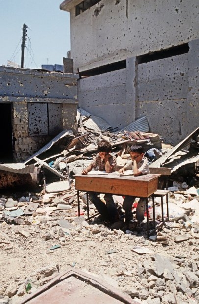 Palestinian children study in the courtyard of the school of the refugee camp in Shatila,near Beirut, 23 June 1985. Palestinian children study in the courtyard of the school of the refugee camp in Shatila,near Beirut, 23 June 1985.