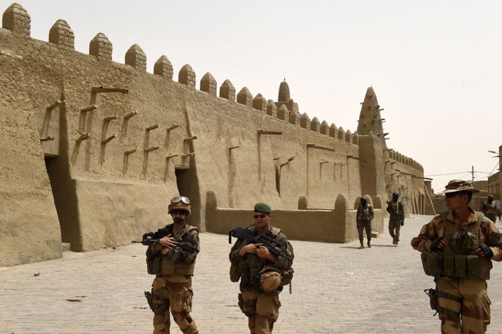 French and Malian soldiers patrol near the Djingareyber Mosque in Timbuktu on June 6, 2015 French and Malian soldiers patrol near the Djingareyber Mosque in Timbuktu on June 6, 2015