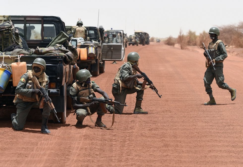 Soldiers of the Malian Army Forces secure the road between Goundam and Timbuktu, northern Mali, on June 2, 2015 Soldiers of the Malian Army Forces secure the road between Goundam and Timbuktu, northern Mali, on June 2, 2015