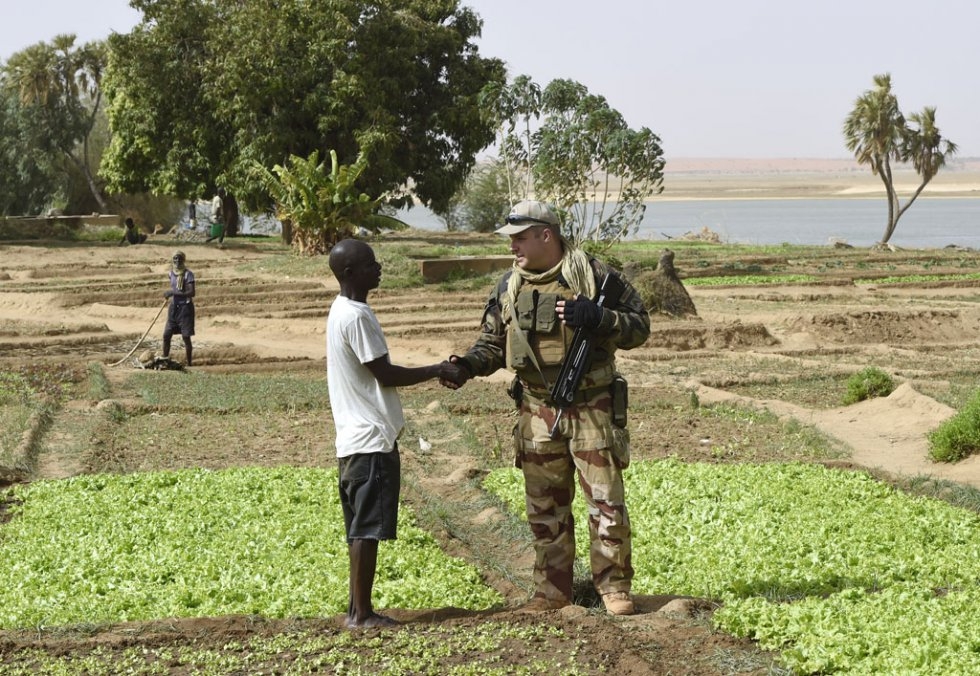 A French soldier greets a farmer on the banks of the Niger river in Gao, on May 30, 2015 A French soldier greets a farmer on the banks of the Niger river in Gao, on May 30, 2015