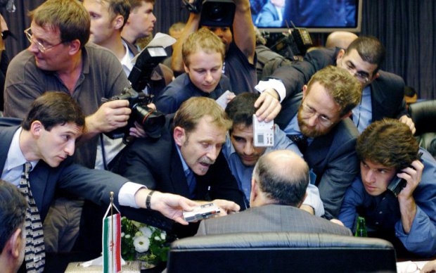 Reporters scramble to get close to Iran's oil minister, Bijen Namdar Zangeneh, during the traditional 'gang bang' of OPEC oil ministers in Vienna, on Sept 15, 2004. Reporters scramble to get close to Iran's oil minister, Bijen Namdar Zangeneh, during the traditional 'gang bang' of OPEC oil ministers in Vienna, on Sept 15, 2004.