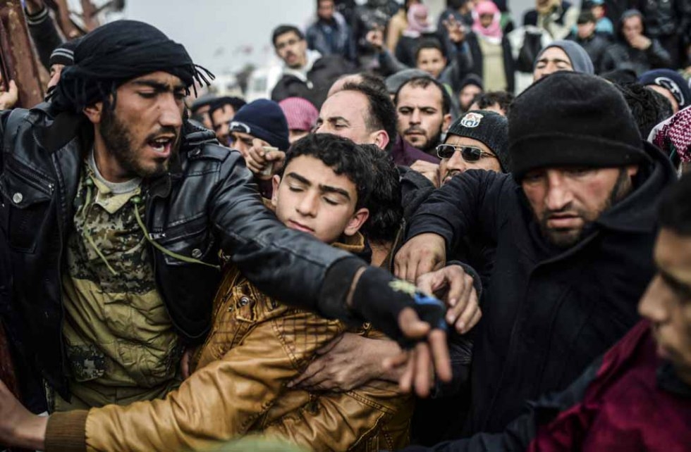 Pushing and shoving while waiting for tents. February 6, 2016. Pushing and shoving while waiting for tents. February 6, 2016.