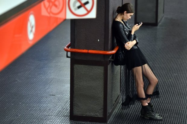 A model waits in a metro station after the Dolce & Gabbana show on September 21 A model waits in a metro station after the Dolce & Gabbana show on September 21