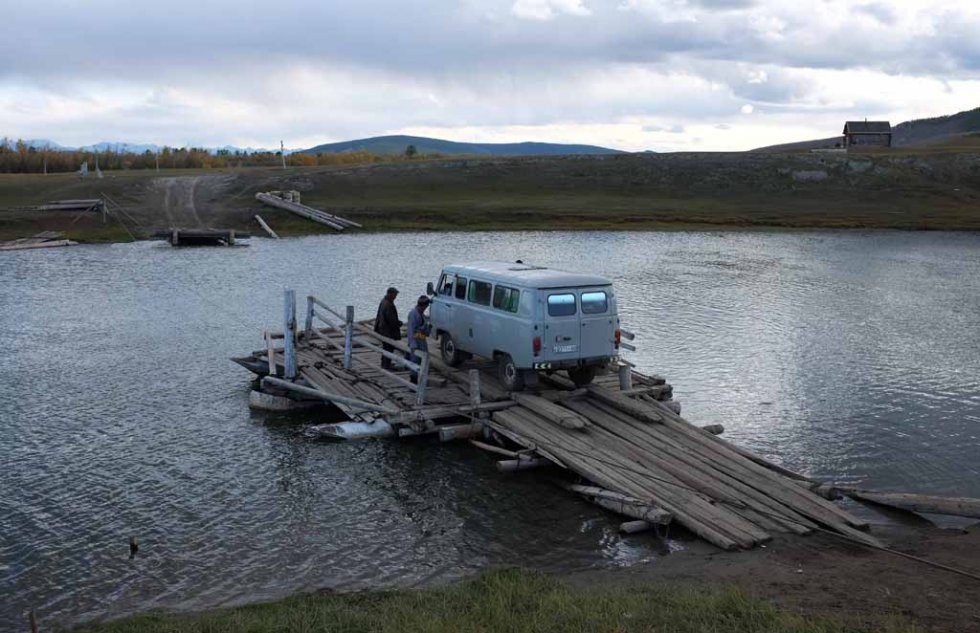 The UAZ wonder van is loaded onto a raft for a river crossing. The UAZ wonder van is loaded onto a raft for a river crossing.