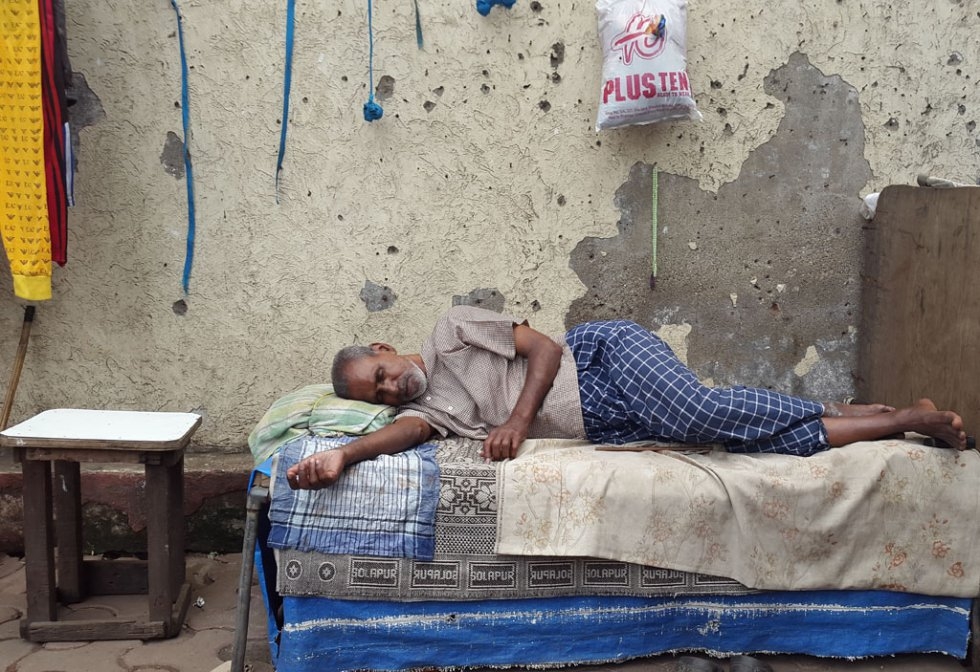 "I was a bit early for an assignment at Mumbai's famous red-light district of Kamathipura and so decided to walk around to look for some pics. I was ambling across when I saw this man sleeping blissfully while everything around him was awake and getting r "I was a bit early for an assignment at Mumbai's famous red-light district of Kamathipura and so decided to walk around to look for some pics. I was ambling across when I saw this man sleeping blissfully while everything around him was awake and getting r