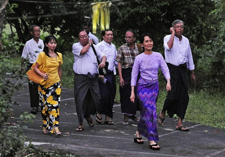 Suu Kyi walks to address her supporters outside the gates of her house after her release from house arrest in 2010. Suu Kyi walks to address her supporters outside the gates of her house after her release from house arrest in 2010.