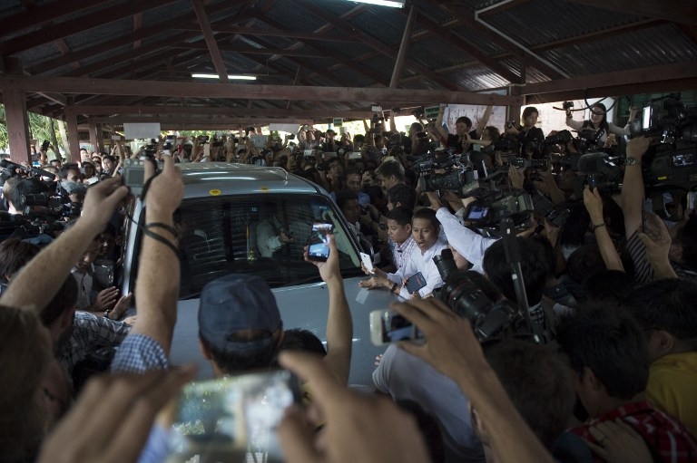 Media mob Suu Kyi's car at a polling station during the November 8 poll. Media mob Suu Kyi's car at a polling station during the November 8 poll.