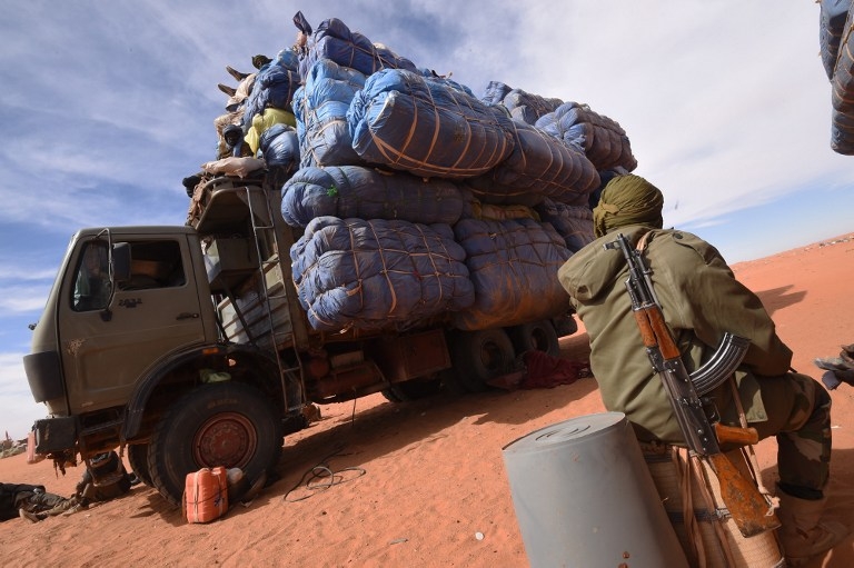 A Niger soldier waits near a truck belonging to sellers in Madama on January 1, 2015 A Niger soldier waits near a truck belonging to sellers in Madama on January 1, 2015