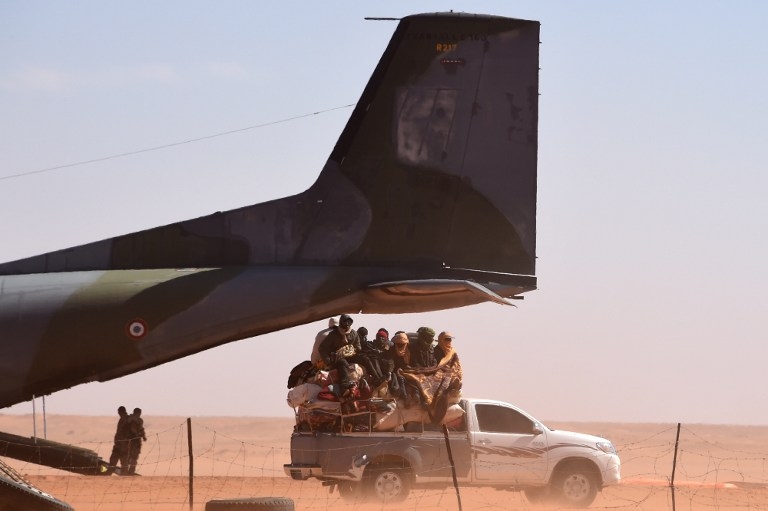 A loaded pick-up truck near a French military plane, in Madama, Niger on January 1, 2015 A loaded pick-up truck near a French military plane, in Madama, Niger on January 1, 2015