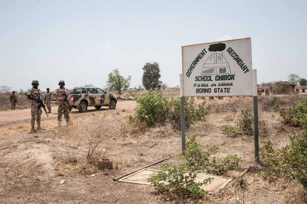 The sign at the entrance of the school, with the word "girls The sign at the entrance of the school, with the word "girls