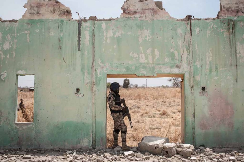 A soldier stands in the ruins of the school, March, 2016. A soldier stands in the ruins of the school, March, 2016.