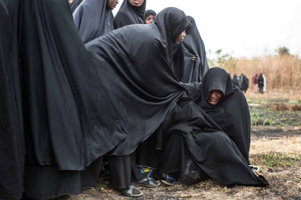 A woman cries at a funeral of a young student killed after soldiers shot into a crowd on the side of a road in Kaduna. March, 2015. A woman cries at a funeral of a young student killed after soldiers shot into a crowd on the side of a road in Kaduna. March, 2015.