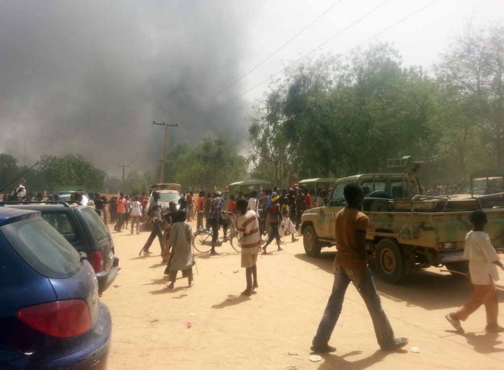 People watch smoke rise in Maiduguri in March, 2014, after Boko Haram fighters attacked a military base, freeing dozens of insurgents. People watch smoke rise in Maiduguri in March, 2014, after Boko Haram fighters attacked a military base, freeing dozens of insurgents.