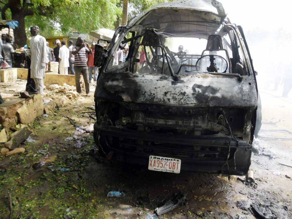 The charred carcass of a bus targetted in a suicide attack in the northeastern town of Potiskum, after twin blasts killed at least 27 people. February, 2015. The charred carcass of a bus targetted in a suicide attack in the northeastern town of Potiskum, after twin blasts killed at least 27 people. February, 2015.
