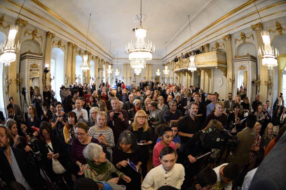 Journalists wait for the announcement of the winner of the 2015 Nobel Prize in Literature at the Swedish Academy on October 8, 2015 Journalists wait for the announcement of the winner of the 2015 Nobel Prize in Literature at the Swedish Academy on October 8, 2015