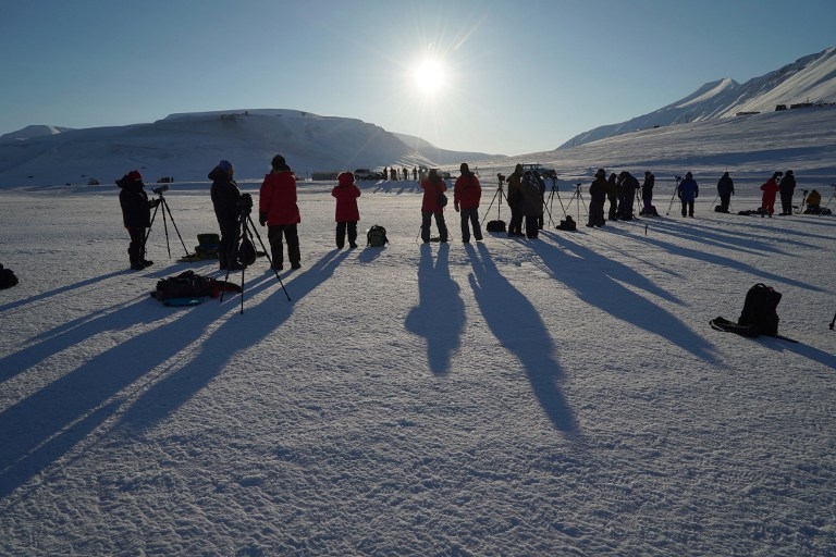 Watching the partial phase of a total solar eclipse in Longyearbyen, Svalbard, on March 20, 2015 Watching the partial phase of a total solar eclipse in Longyearbyen, Svalbard, on March 20, 2015