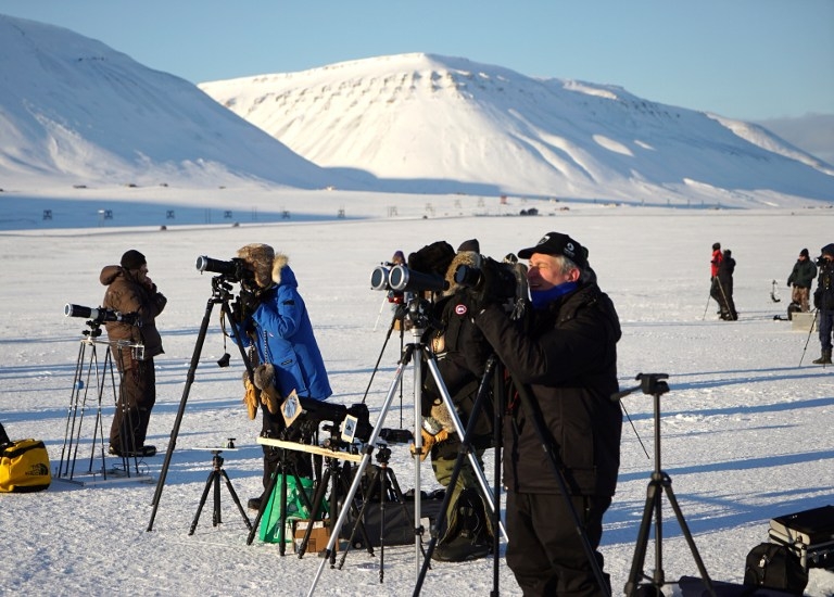 Watching the partial phase of a total solar eclipse in Longyearbyen, Svalbard, on March 20, 2015 Watching the partial phase of a total solar eclipse in Longyearbyen, Svalbard, on March 20, 2015
