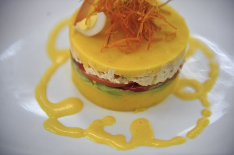 'Causa', the Peruvian traditional dish made with layers of spiced potato 'Causa', the Peruvian traditional dish made with layers of spiced potato