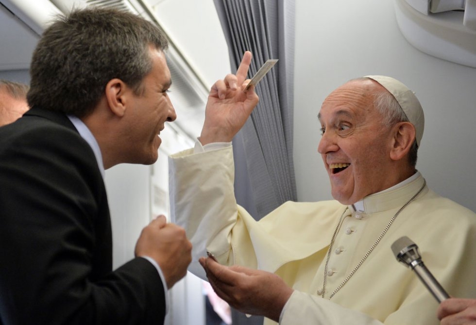 Pope Francis jokes with journalists on a plane to Rio de Janeiro on July 22, 2013 Pope Francis jokes with journalists on a plane to Rio de Janeiro on July 22, 2013