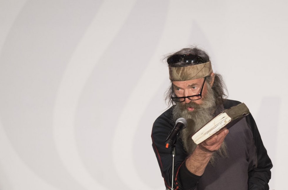 Reality TV's Duck Dynasty star Phil Robertson holds up his Bible during a campaign rally for Ted Cruz in Charleston, South Carolina, on February 19, 2016 Reality TV's Duck Dynasty star Phil Robertson holds up his Bible during a campaign rally for Ted Cruz in Charleston, South Carolina, on February 19, 2016