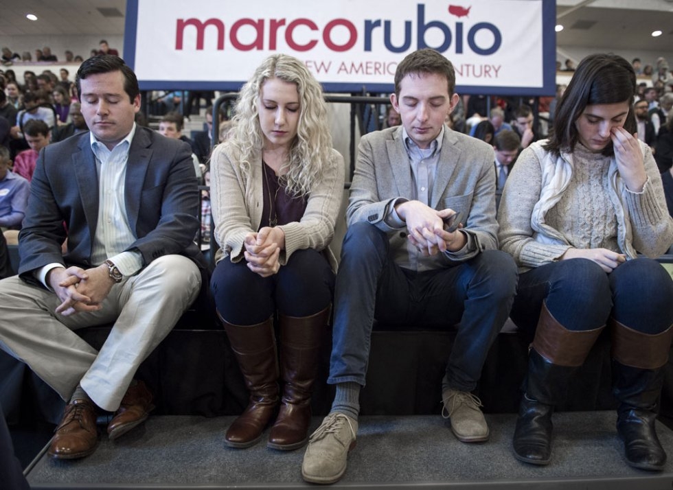 Supporters pause for a prayer shortly before Marco Rubio speaks in Purcellville, Virginia, on February 28, 2016 Supporters pause for a prayer shortly before Marco Rubio speaks in Purcellville, Virginia, on February 28, 2016