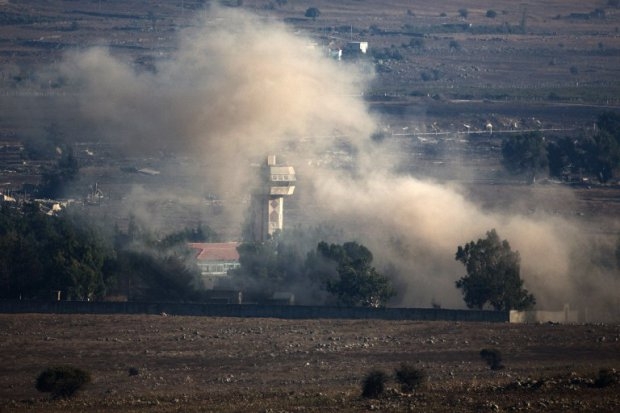 In a picture taken from the Israeli-annexed Golan Heights, smoke billows from the Syrian village of Quneitra following an explosion during fighting on August 31, 2014 In a picture taken from the Israeli-annexed Golan Heights, smoke billows from the Syrian village of Quneitra following an explosion during fighting on August 31, 2014