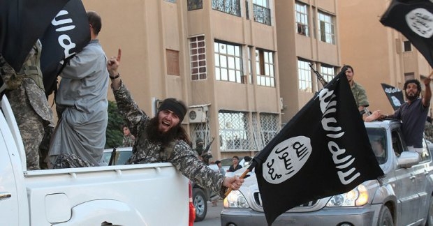 An image made available by Jihadist media outlet Welayat Raqa on June 30, 2014, allegedly shows an IS militant parading in the northern rebel-held Syrian city of Raqa An image made available by Jihadist media outlet Welayat Raqa on June 30, 2014, allegedly shows an IS militant parading in the northern rebel-held Syrian city of Raqa
